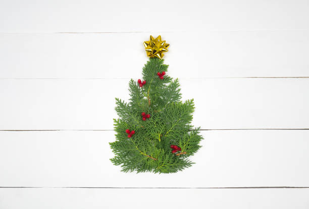 istock Creative Christmas layout. Christmas tree on white wood background. 1176725763