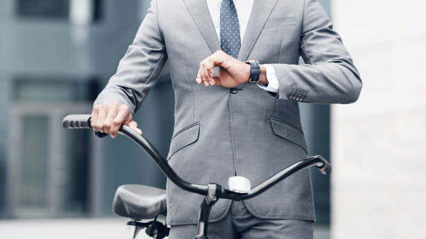 istock Confident businessman looking at his watch, going to work 1176728614