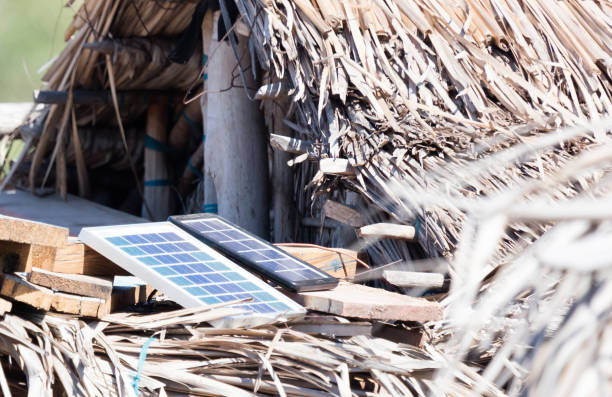 istock Small solar panels on a large roof in Madagascar 1176729675