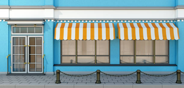 istock Small store building facade with big windows and awnings 1176732242