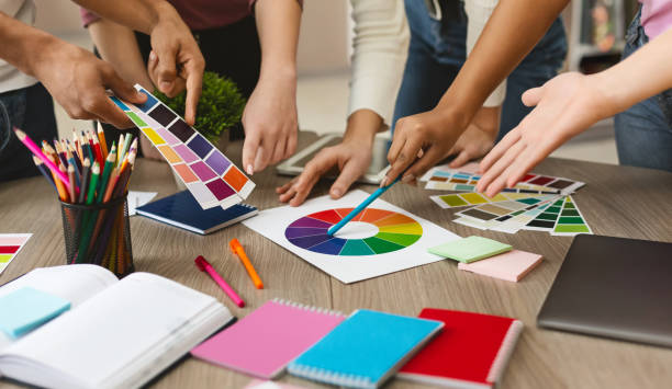 istock Group of young graphic designers choosing color swatch samples 1176732277