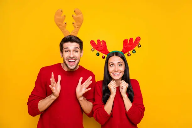 Photo of Portrait of impressed spouses scream wow omg wait for sales discount wear red sweater isolated over yellow background