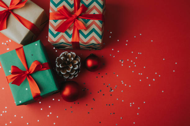 istock Christmas presents and ornaments on a red background 1176736166
