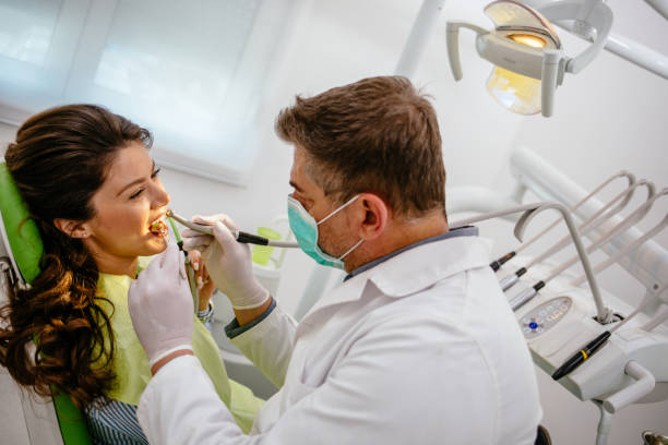 istock Young woman at dentist's office replacing fillings 1176737301
