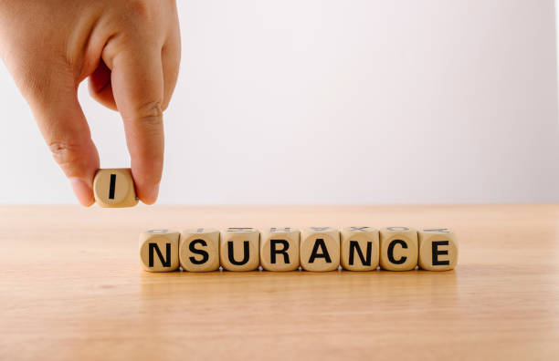 istock Cube block wood with word insurance on wooden background. 1176739574