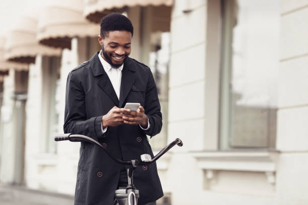 istock Businessman chatting on phone, going to work by bike 1176739708