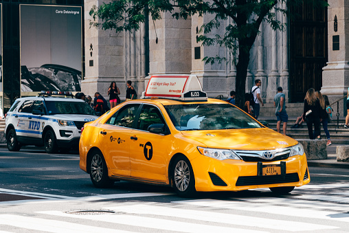 New York City, USA - June 26, 2018: Yelllow taxi speeding up in Fifth Avenue