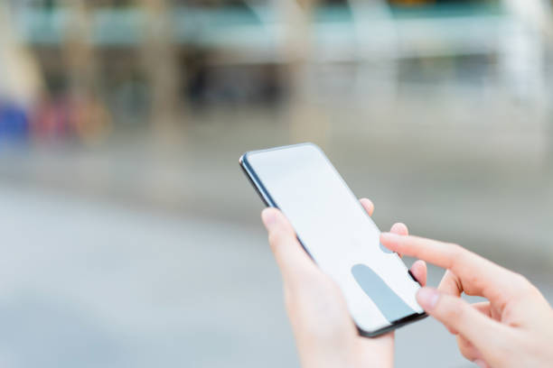 istock Hand holding smartphone blank screen on isolated. Take your screen to put on advertising. 1176741237