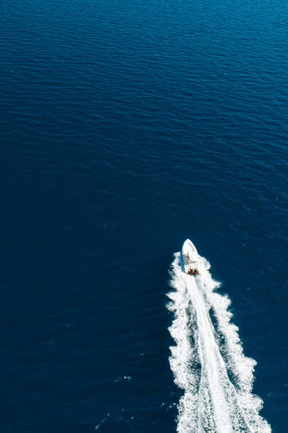 istock fast motor boat on sea from above 1176741692