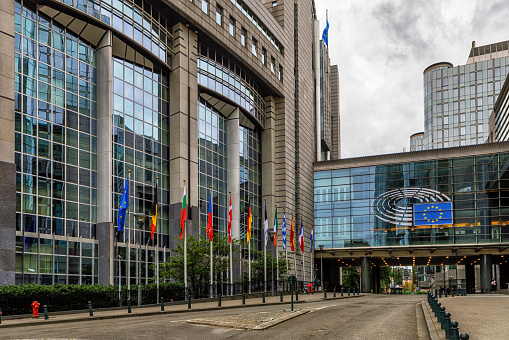Square in front of the European Parliament building and Facade of the modern office buildings of the European Parliament. The European Parliament is the legislative branch of the European Union and one of its seven institutions.