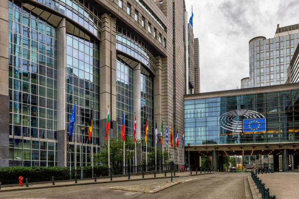 European Parliament Building in Brussels, Belgium Square in front of the European Parliament building and Facade of the modern office buildings of the European Parliament. The European Parliament is the legislative branch of the European Union and one of its seven institutions. european union symbol stock pictures, royalty-free photos & images