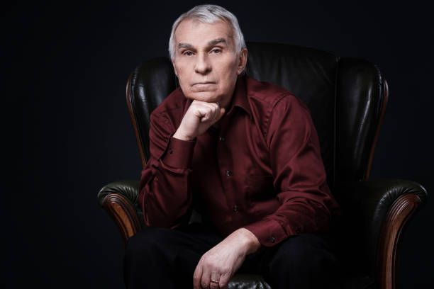 istock Senior man in armchair 1176743099