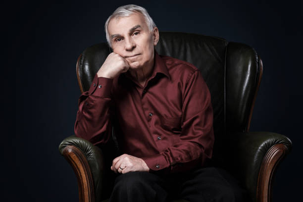 istock Senior man in armchair 1176743864