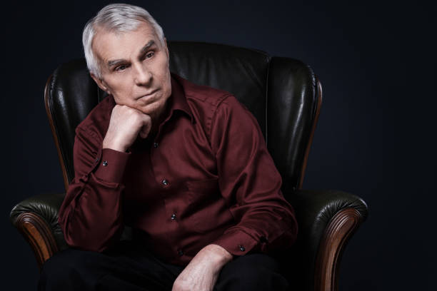 istock Senior man in armchair 1176743962