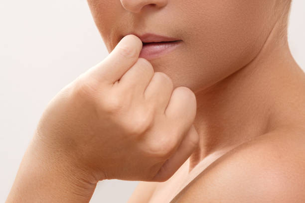 istock Woman bitting her fingers 1176745091