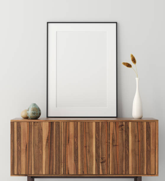 istock Mock up poster frame on wooden cabinet in home interior 1176746956