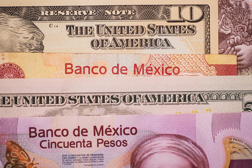 Diverse United States Dollar (USD) and Mexican Peso (MXN) bills