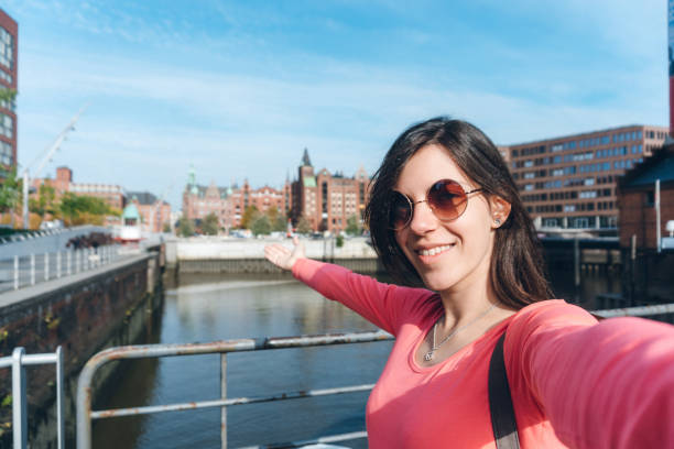 istock Tourist making selfies / vlogging in Hafen City 1176747827