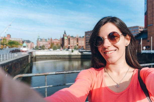 istock Tourist making selfies / vlogging in Hafen City 1176747834