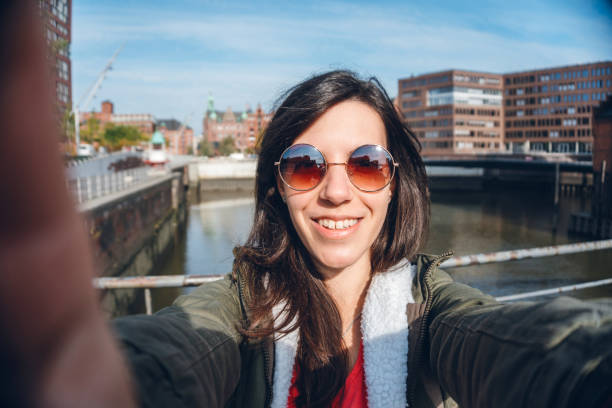 istock Tourist making selfies / vlogging in Hafen City 1176747875