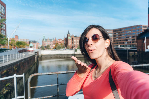 istock Tourist making selfies / vlogging in Hafen City 1176747908