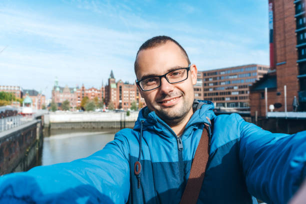 istock Tourist making selfies / vlogging in Hafen City 1176747944