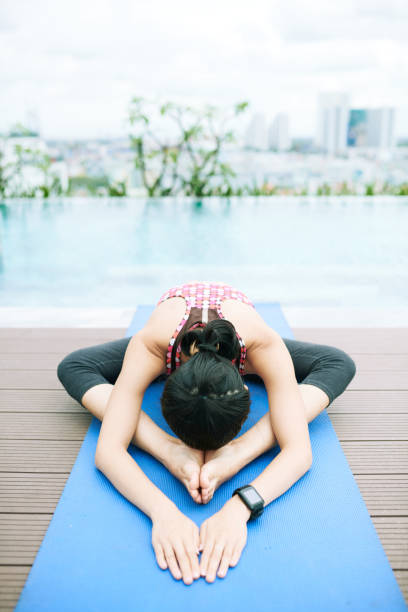 istock Woman relaxing during yoga 1176749325