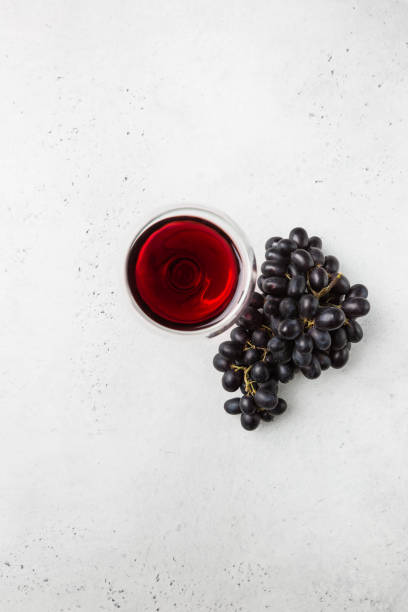 istock Red wine and ripe grapes 1176749995