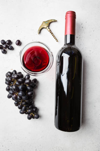 istock Red wine and ripe grapes 1176750008