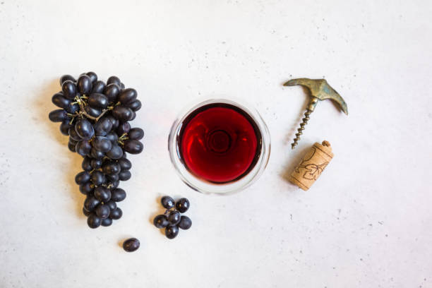 istock Red wine and ripe grapes 1176750038