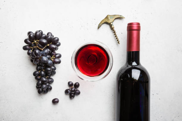 istock Red wine and ripe grapes 1176750063