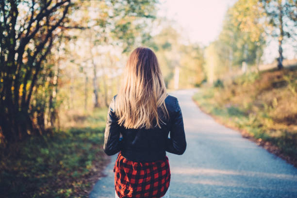 Rear view of woman on a leisure walk among nature