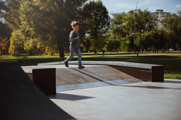 istock Little boy having fun in skate park 1176752550