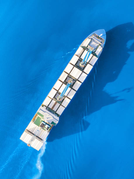 istock Large container ship sailing blue sea. Top aerial view 1176753038