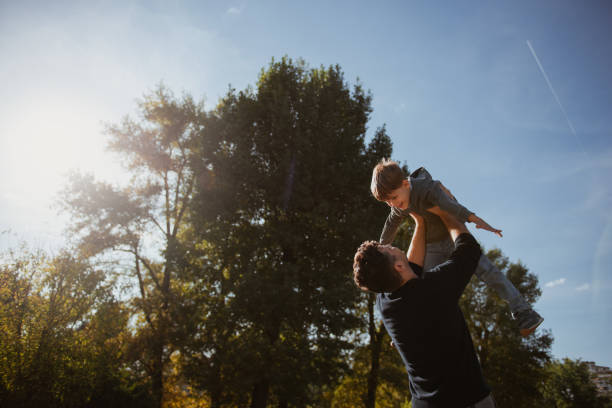 istock Father and Son having fun in the park 1176753161