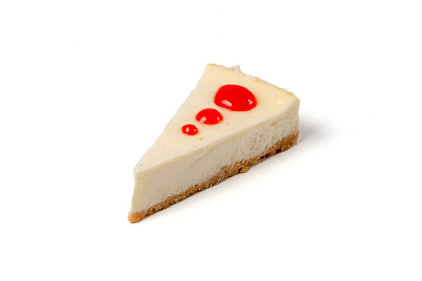 istock Piece of cheesecake with strawberry jam drops isolated on white background 1176753355