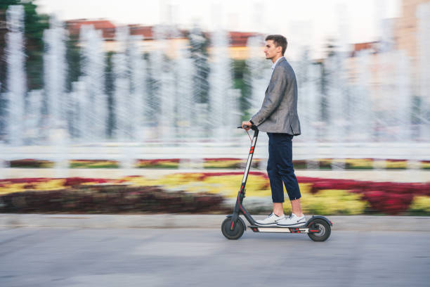 istock Man riding e-scooters in the city 1176754044