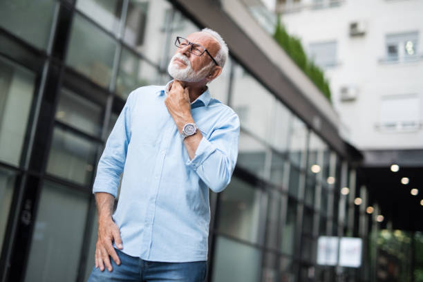 istock Senior man feeling throat pain. 1176754312