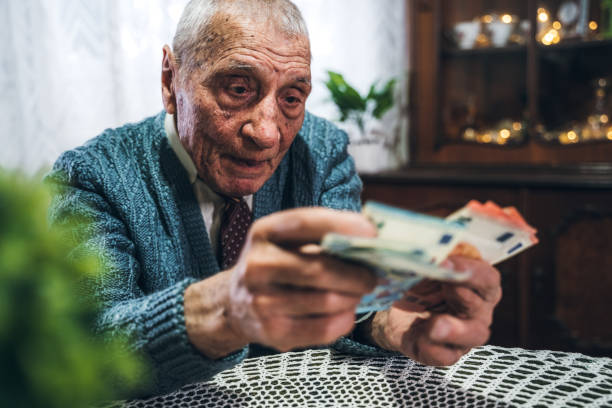 istock Senior man holding euros 1176755951