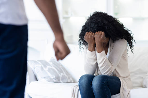 istock Domestic violence. Scared woman hiding her face in hands. 1176756019