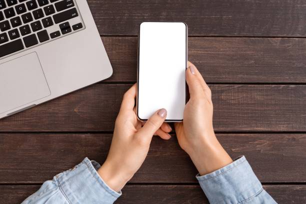 istock Smartphone with blank screen for your advertising in woman's hands 1176756185