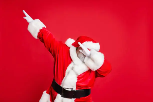 Photo of Portrait of his he nice attractive careless bearded Santa having fun leisure fairy eve noel fest celebratory wintertime isolated over bright vivid shine red background