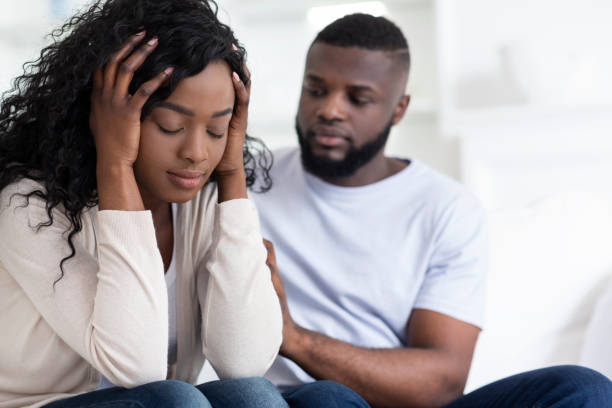 istock Loving african man soothing upset girlfriend, apologizing after quarrel 1176756277