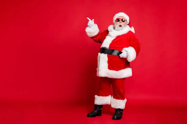 Full length body size view of his he amazed funky fat overweight plump gray-haired bearded man showing black Friday ad advert copy space, isolated over bright vivid shine red background