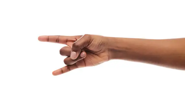 We will rock you. Black female hand making rock'n'roll gesture isolated on white background, panorama with copy space