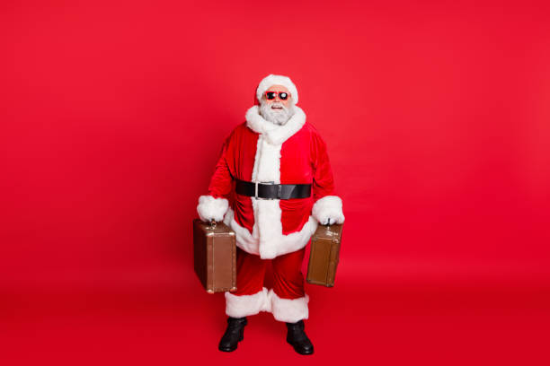 Full length body size view of nice attractive cheerful cheery content, fat bearded man carrying vintage bags luggage baggage ready voyage isolated on bright vivid shine red background