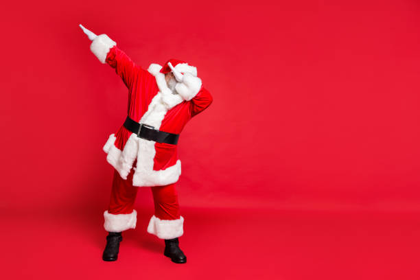 Full length body size view of his he carefree fat overweight plump gray-haired, bearded man St Saint Nicholas having fun christmas time occasion isolated over bright vivid shine red background Full length body size view of his he carefree fat overweight plump gray-haired, bearded man St Saint Nicholas having fun christmas time occasion isolated over bright vivid shine red background dab dance photos stock pictures, royalty-free photos & images