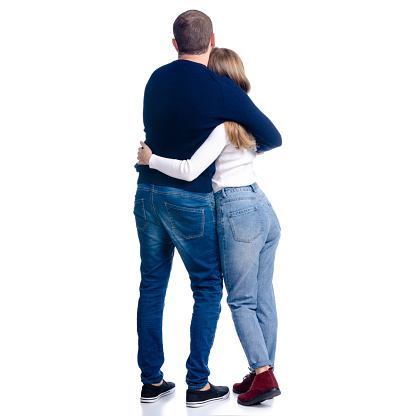 Young couple woman and man hug embrace relationships on white background isolation, rear view