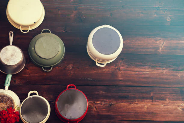 Pots and pans on wooden rustic background Pots and pans on wooden rustic background moules frites stock pictures, royalty-free photos & images