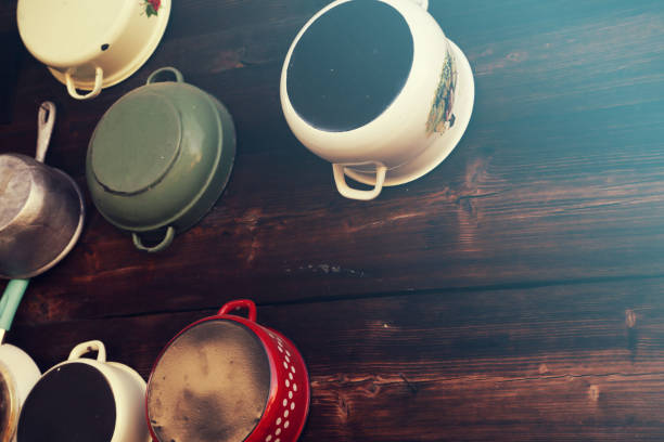 Pots and pans on wooden rustic background